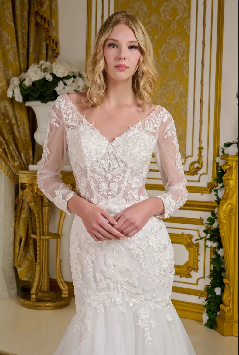 This wedding gown features a wide V-neckline and sheer long sleeves, delicately adorned with beads, embroidery. GL3659 GLS BY GLORIA
