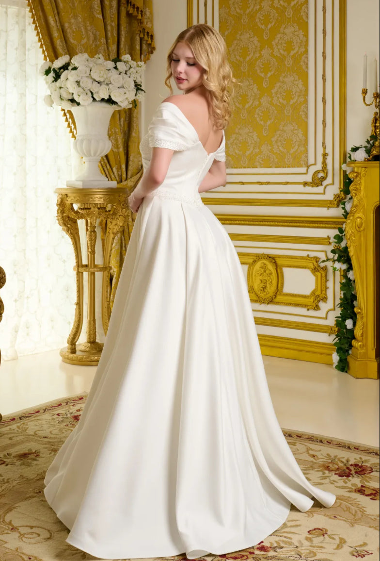 This satin wedding gown embraces a minimalist aesthetic. GL3655 GLS BY GLORIA