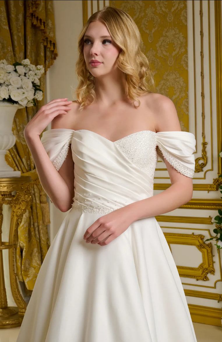 This satin wedding gown embraces a minimalist aesthetic. GL3655 GLS BY GLORIA