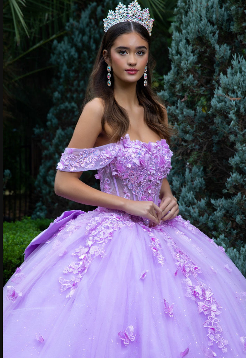 This floor length ball gown is heavily adorned with 3D flower and butterfly appliques, jewels and sequined embroidery. GL3524 (GLS) by Gloria