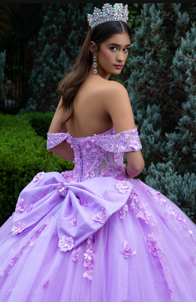 This floor length ball gown is heavily adorned with 3D flower and butterfly appliques, jewels and sequined embroidery. GL3524 (GLS) by Gloria