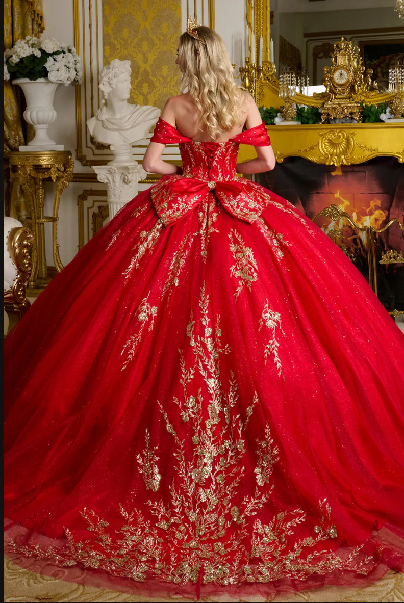 The gown is richly adorned with jewels, sequins, and glitter. GL3631 GLS BY ELIZABETH K