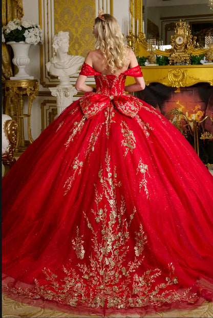 The gown is richly adorned with jewels, sequins, and glitter. GL3631 GLS BY ELIZABETH K