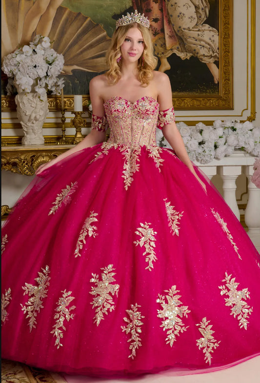 This enchanting ball gown showcases a sheer sweetheart bodice richly adorned with shimmering jewels. GL3641 BY ELIZABETH K