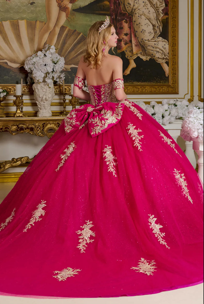 This enchanting ball gown showcases a sheer sweetheart bodice richly adorned with shimmering jewels. GL3641 BY ELIZABETH K
