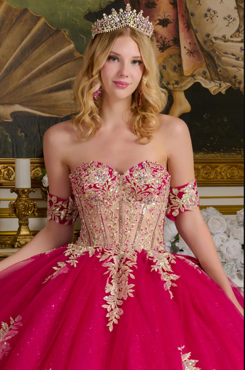 This enchanting ball gown showcases a sheer sweetheart bodice richly adorned with shimmering jewels. GL3641 BY ELIZABETH K