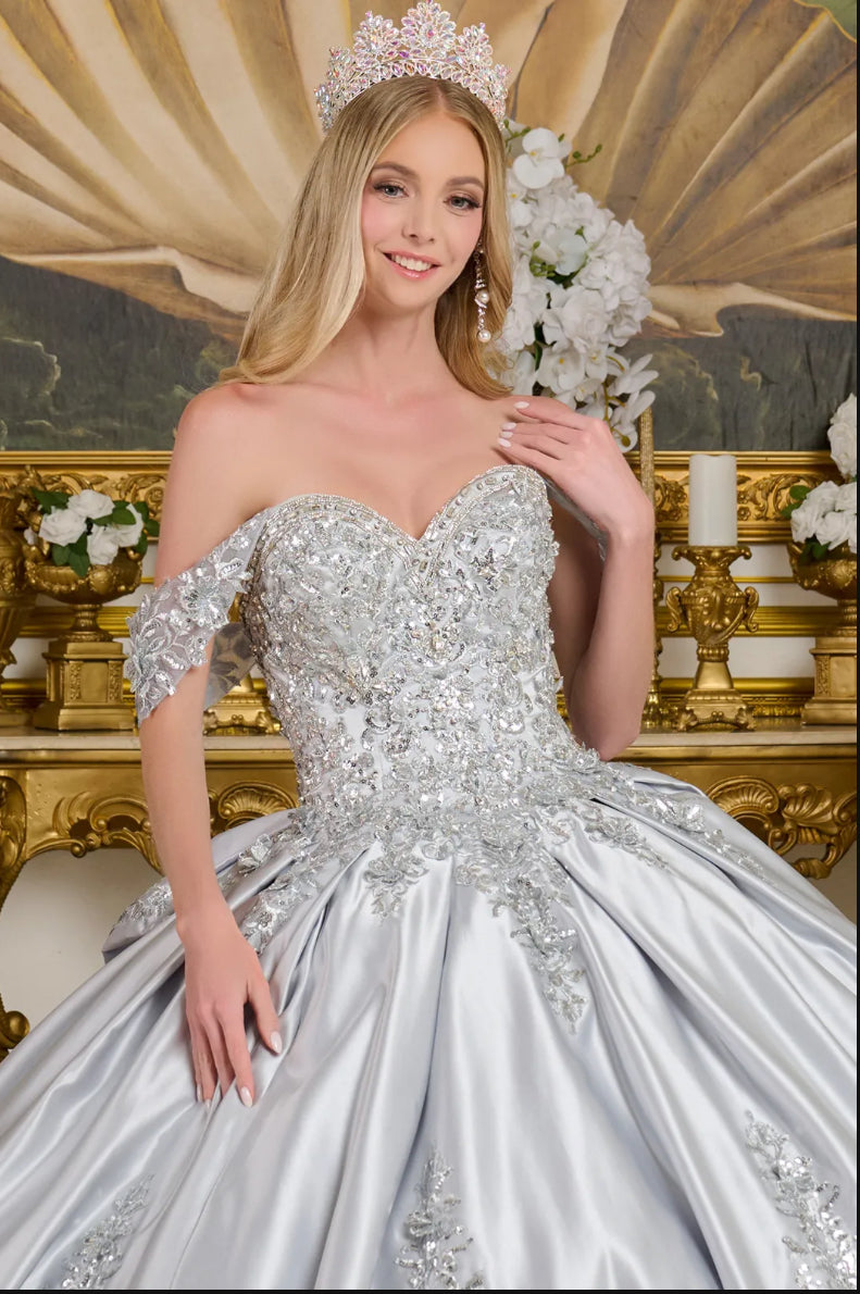 This satin ball gown is richly adorned with 3D floral appliqués, beading, embroidery, jewels, and sequins.  GL3643 ELIZABETH K