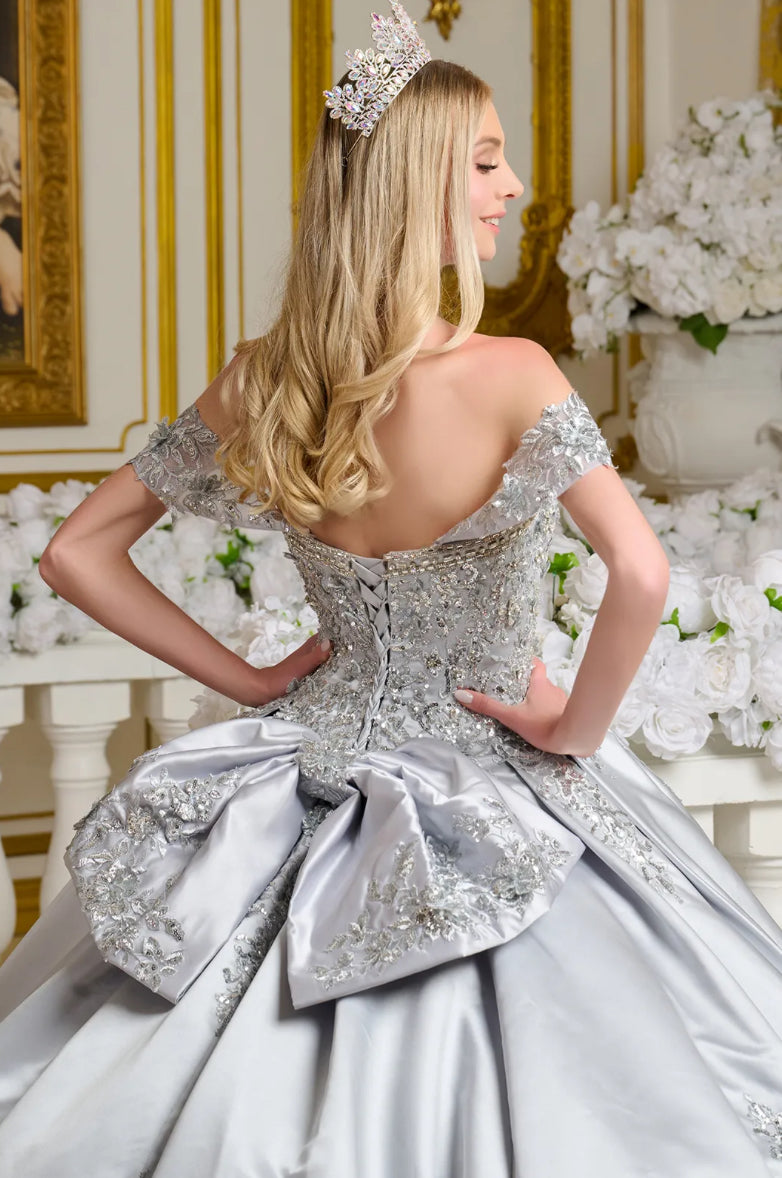 This satin ball gown is richly adorned with 3D floral appliqués, beading, embroidery, jewels, and sequins.  GL3643 ELIZABETH K