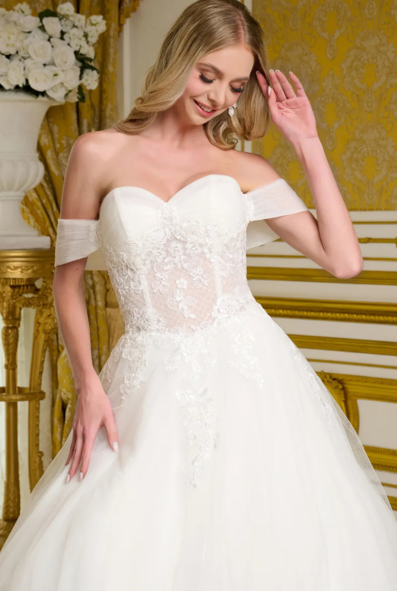 This elegant wedding gown showcases a voluminous. GL3657 GLS BY GLORIA