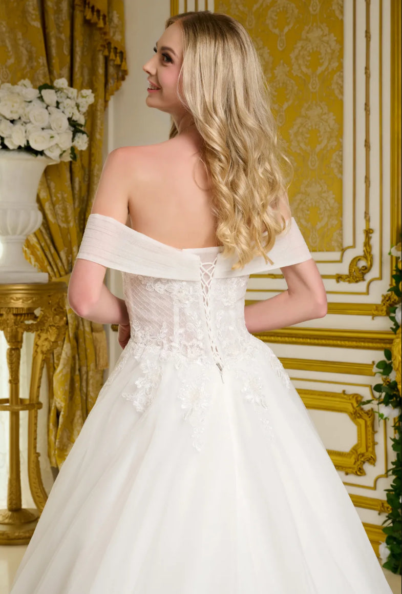 This elegant wedding gown showcases a voluminous. GL3657 GLS BY GLORIA