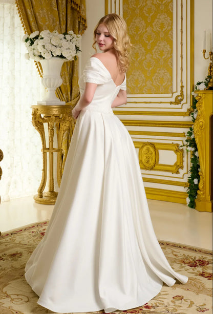 This satin wedding gown embraces a minimalist aesthetic. GL3655 GLS BY GLORIA