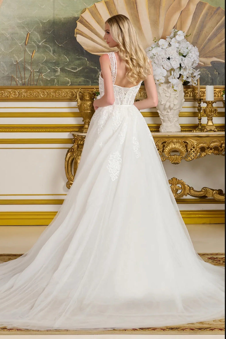 This form-fitting wedding gown features multiple beaded spaghetti straps that connect to the sweetheart neckline bodice. GL3654 GLS BY GLORIA