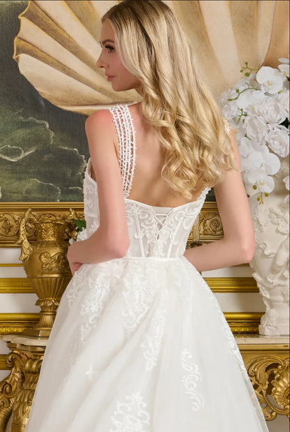 This form-fitting wedding gown features multiple beaded spaghetti straps that connect to the sweetheart neckline bodice. GL3654 GLS BY GLORIA