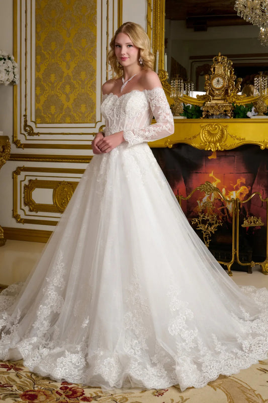 This elegant wedding gown showcases a wide V-neckline that transitions into romantic off-the-shoulder sleeves. GL3653 GLS BY GLORIA