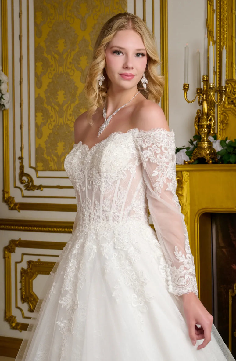 This elegant wedding gown showcases a wide V-neckline that transitions into romantic off-the-shoulder sleeves. GL3653 GLS BY GLORIA