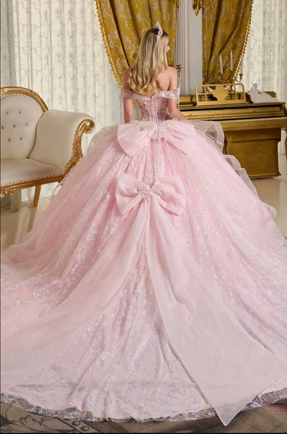 This stunning ball gown is adorned with shimmering 3D butterfly appliqués. GL3651 by Elizabeth K