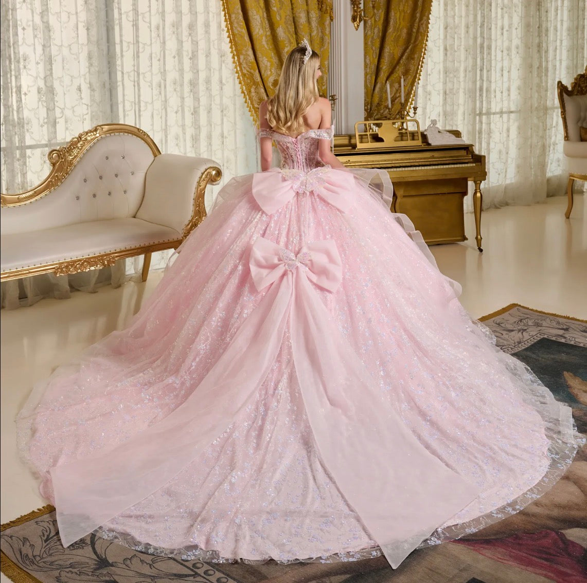 This stunning ball gown is adorned with shimmering 3D butterfly appliqués. GL3651 by Elizabeth K