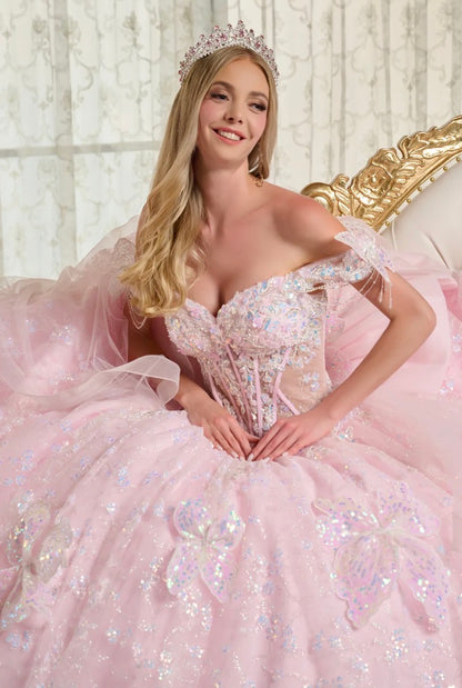 This stunning ball gown is adorned with shimmering 3D butterfly appliqués. GL3651 by Elizabeth K