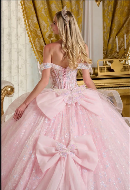 This stunning ball gown is adorned with shimmering 3D butterfly appliqués. GL3651 by Elizabeth K