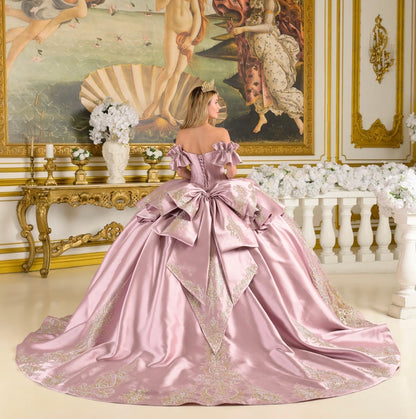 This quinceañera ball gown features off-shoulder ruffle cuff sleeves that frame a V-neckline corset bodice. GL3803 BY ELIZABETH K