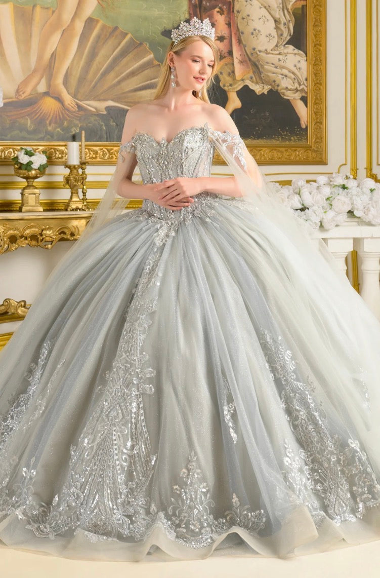 Detachable cape sleeves frame the W-neckline corset bodice of this enchanting ball gown. GL3711 BY ELIZABETH K
