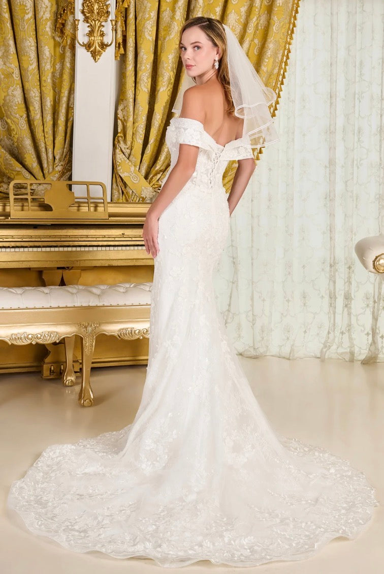 Make a breathtaking entrance in this intricately detailed off-shoulder wedding gown.  GL3827 BY GLORIA