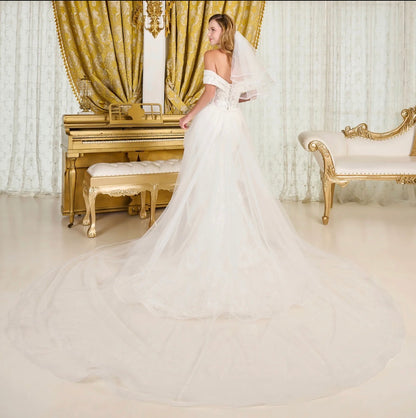 Make a breathtaking entrance in this intricately detailed off-shoulder wedding gown.  GL3827 BY GLORIA