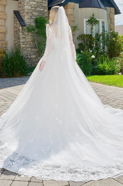 This elegant, wedding ball gown combines modest design. GL3823 GLS BY GLORIA
