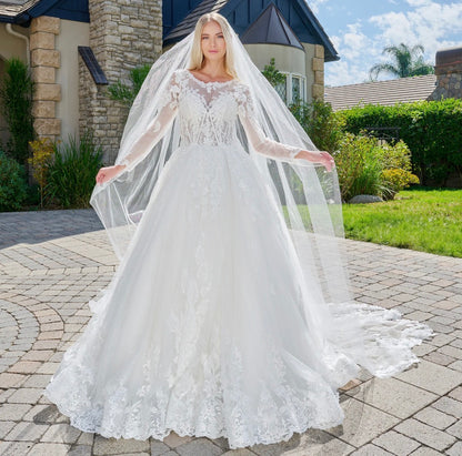 This elegant, wedding ball gown combines modest design. GL3823 GLS BY GLORIA