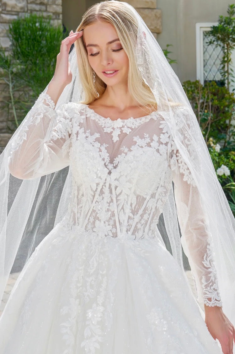 This elegant, wedding ball gown combines modest design. GL3823 GLS BY GLORIA