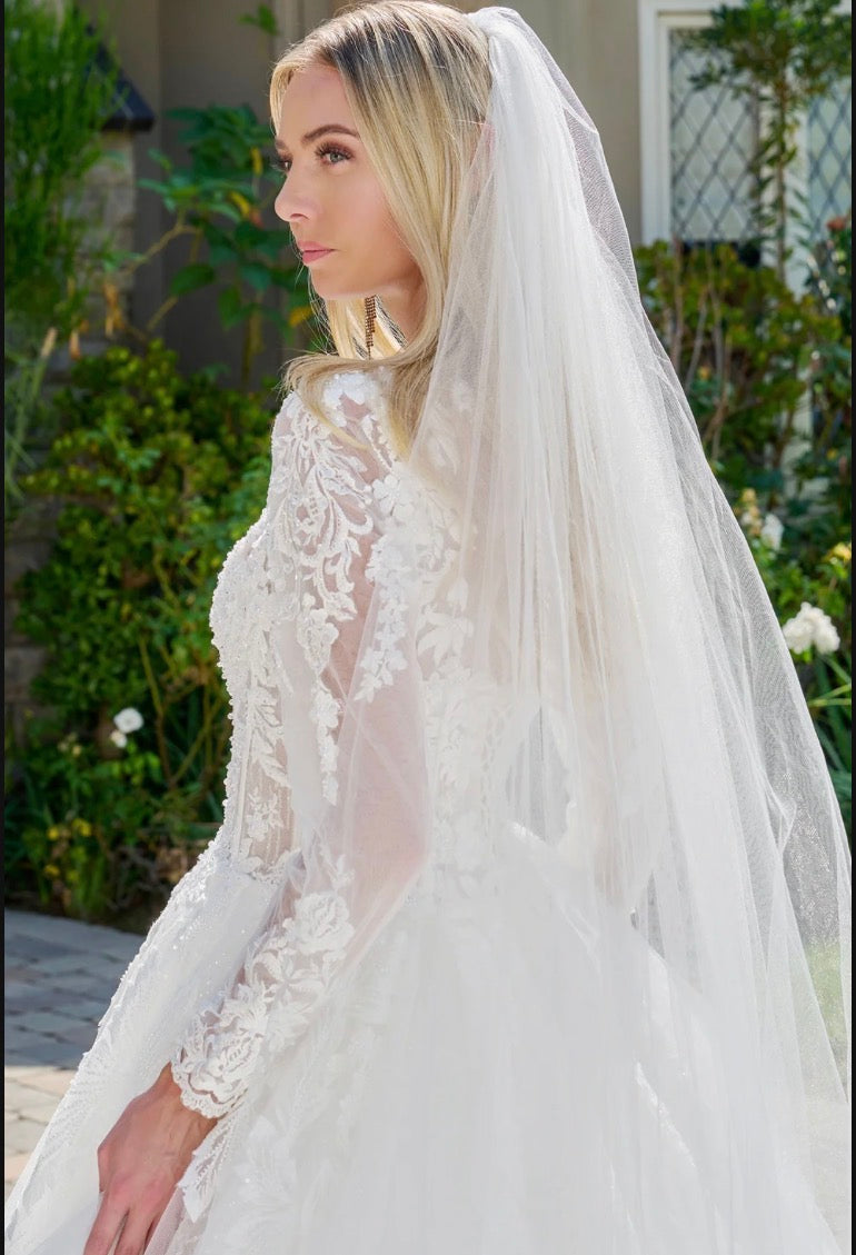 This elegant, wedding ball gown combines modest design. GL3823 GLS BY GLORIA