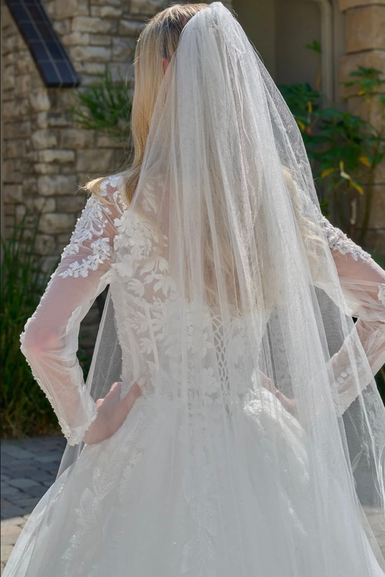 This elegant, wedding ball gown combines modest design. GL3823 GLS BY GLORIA