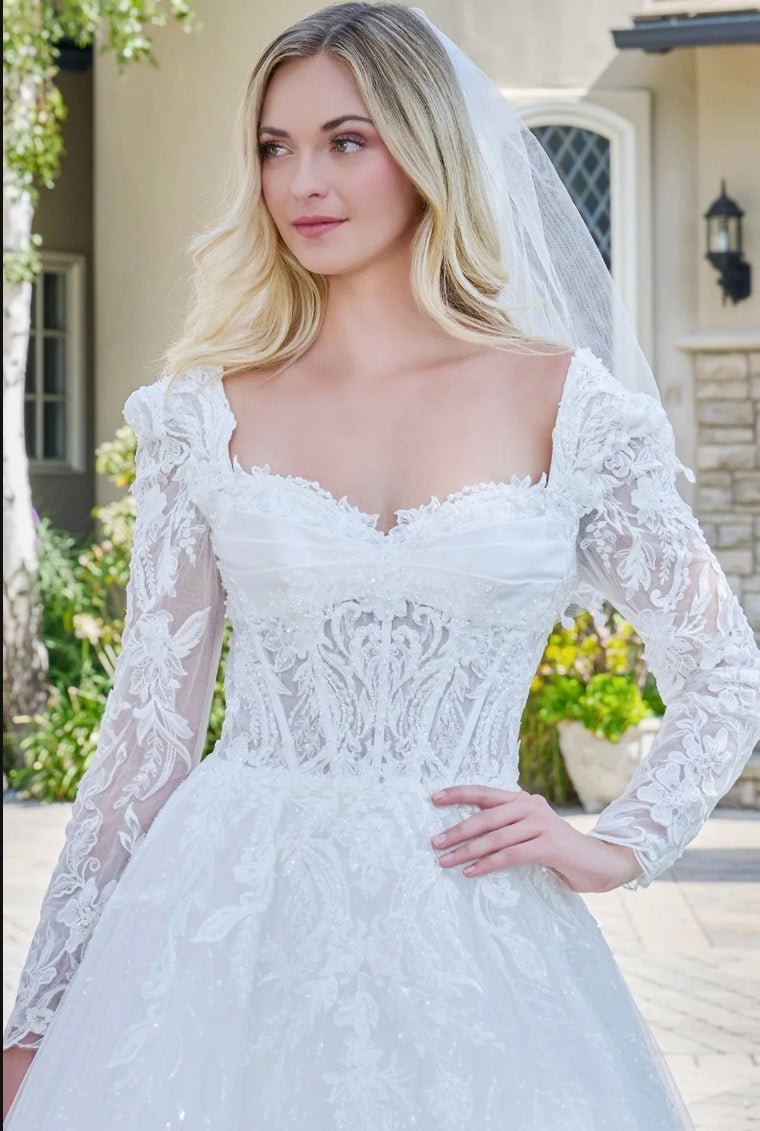 This elegant ball gown wedding dress features a V-neckline. GL3820 GLS BY GLORIA