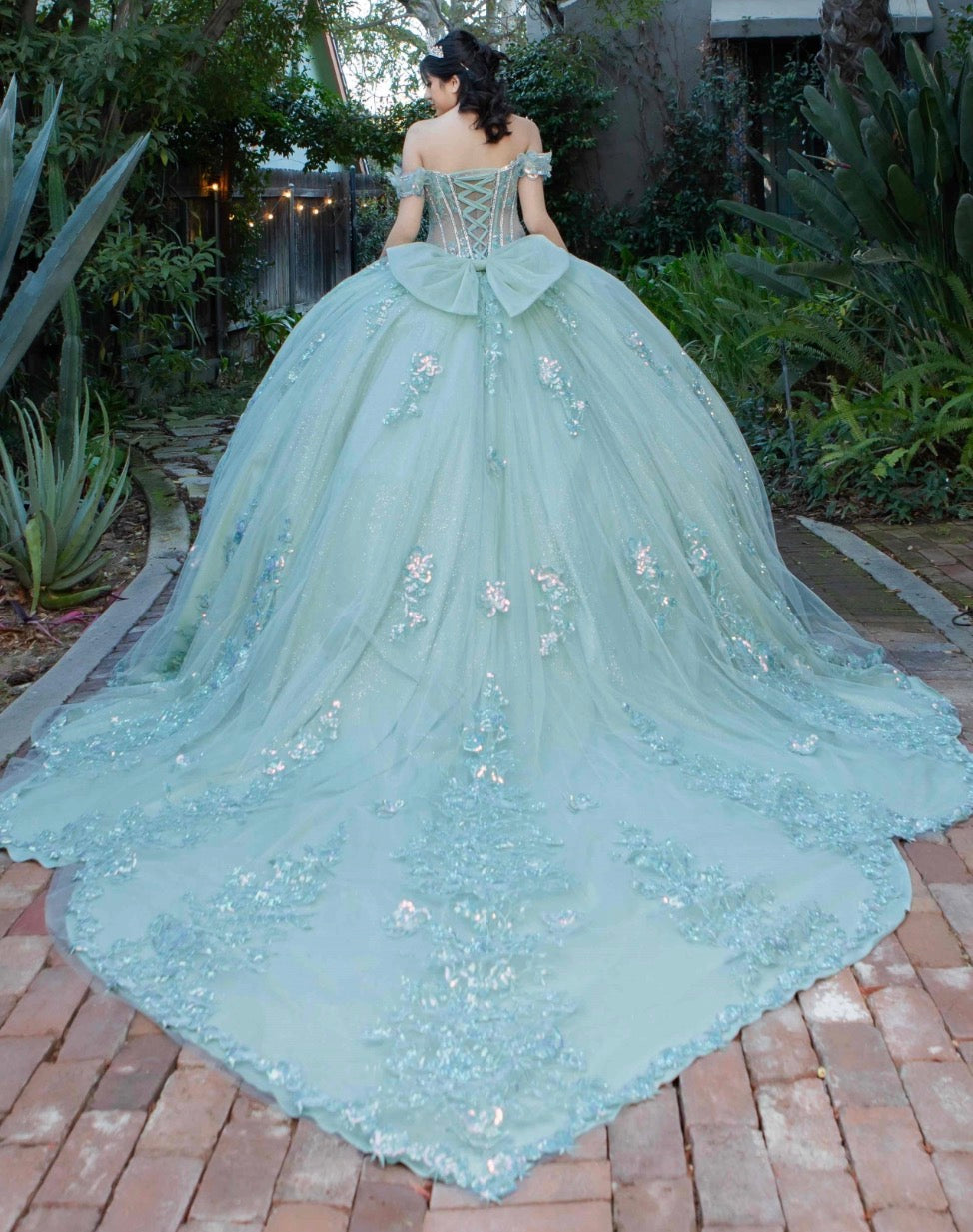 embellished off-the-shoulder straps that frame a flattering V-neckline corset bodice.8370J BY CINDERELLA COUTURE