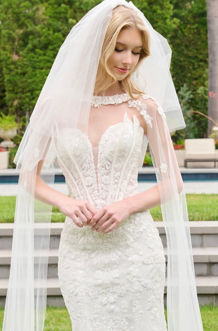 This wedding look features a strapless corset bodice with layered flaps on each side. GL3844 GLS BY GLORIA