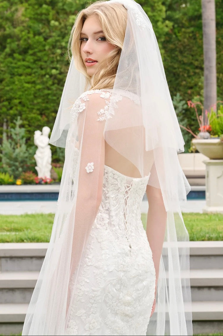 This wedding look features a strapless corset bodice with layered flaps on each side. GL3844 GLS BY GLORIA
