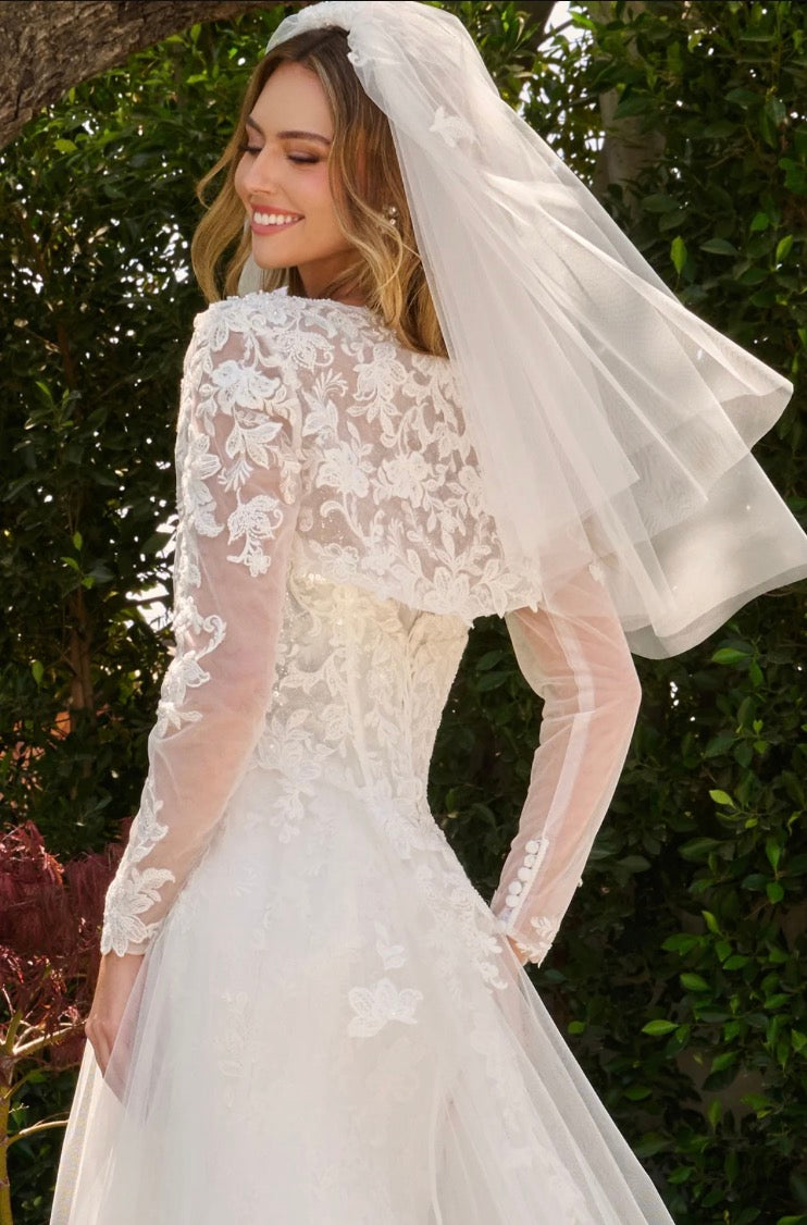 This two-in-one wedding look features a strapless fitted dress with a delicate lace underlayer.  GL3842 GLS BY GLORIA