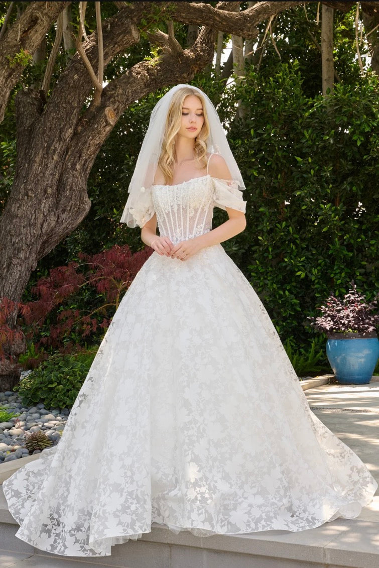 This boat neckline ballgown features a modern cold-shoulder. GL3840 GLS BY GLORIA