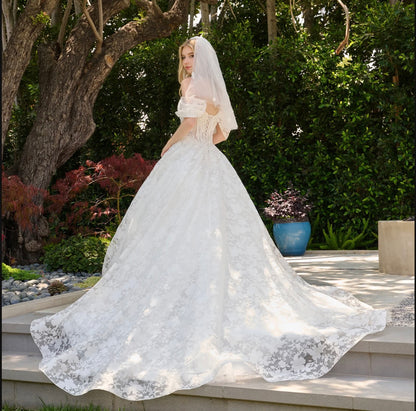 This boat neckline ballgown features a modern cold-shoulder. GL3840 GLS BY GLORIA