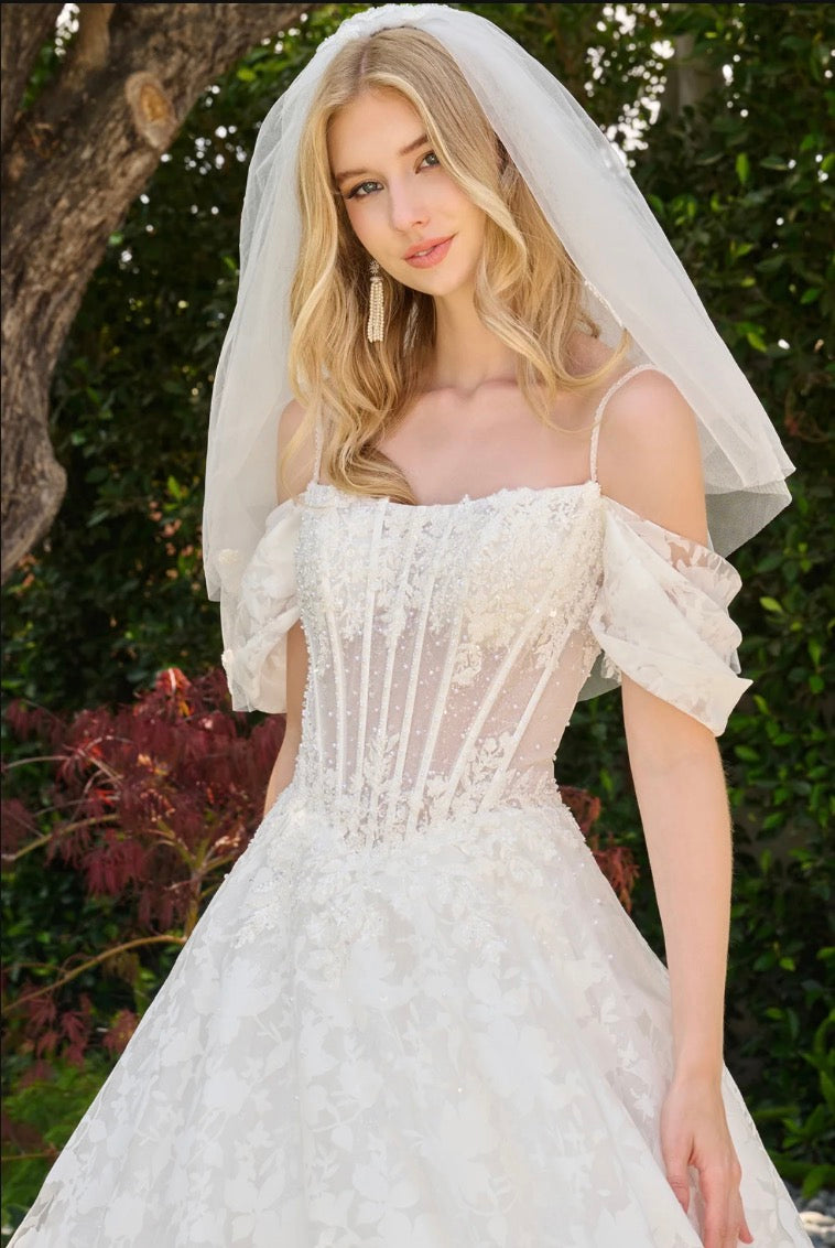 This boat neckline ballgown features a modern cold-shoulder. GL3840 GLS BY GLORIA